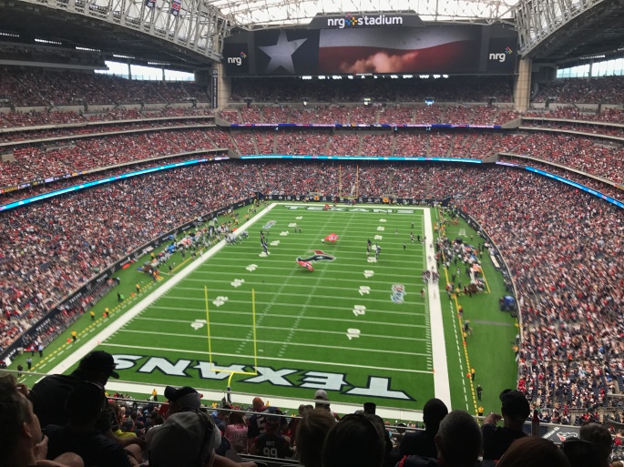 A large football stadium before a game begins.
